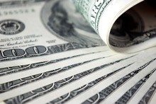 A stack of US dollar bills used to pay the bankruptcy filing fee.