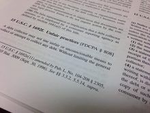 Consumer Credit Lawsuits 101 An open book with text on it.