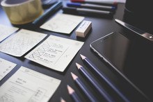 Can an Employer Fire You for Filing Bankruptcy and You Owe Them a Debt? A desk equipped with pens, pencils, and paper.