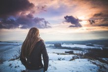 Social Security Bankruptcy: Do you need a social security number to file bankruptcy? A woman is standing on top of a snowy hill overlooking a bankruptcy.