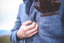 A man in a blue jacket.