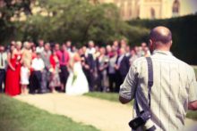 How You Can Use Bankruptcy to Discharge Divorce-based Debts A photographer captures a joyful group at a bankruptcy-friendly wedding ceremony.