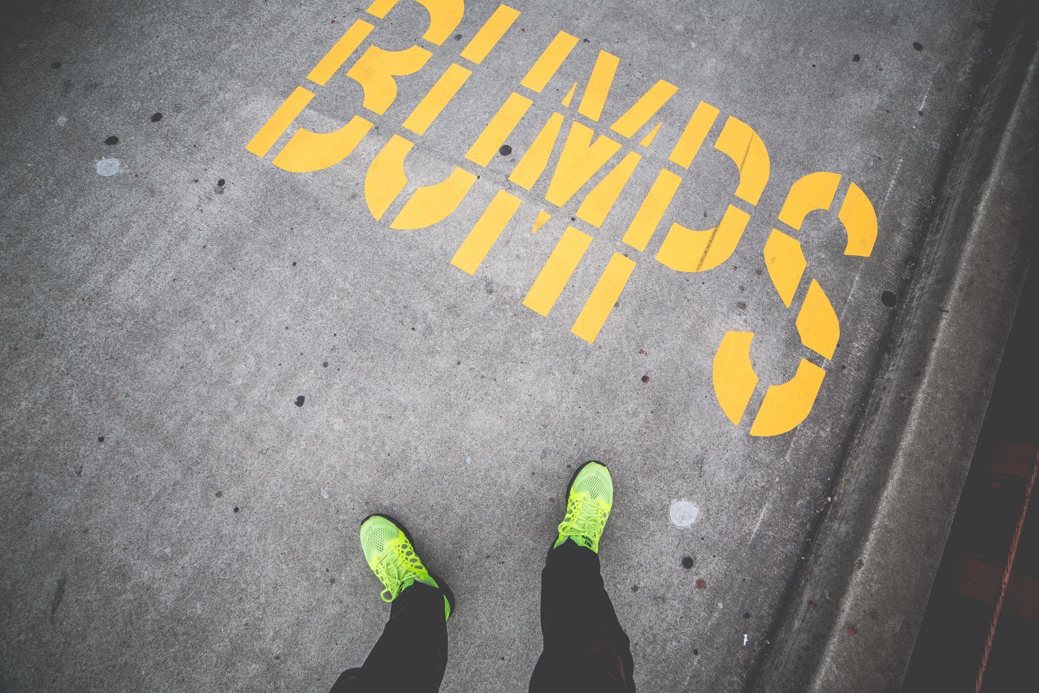 A bankrupt individual standing on a sidewalk with the word 
