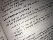 Another Decision Limiting the Dischargeability of Tax Liability! An open book with a page that says 'exemptions to discharge'.